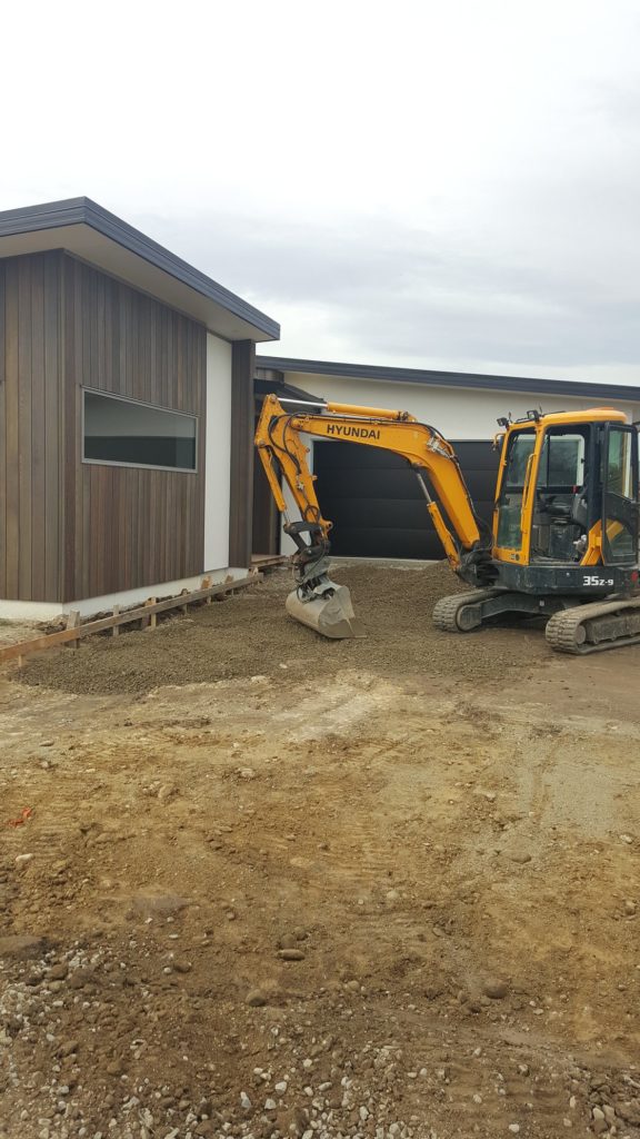 Concrete4U excavating a residential home driveway for concrete placement in Kaiapoi