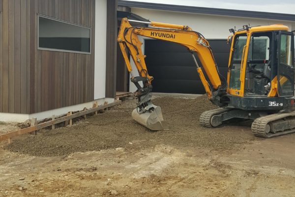 Concrete4U excavating a residential home driveway for concrete placement in Kaiapoi