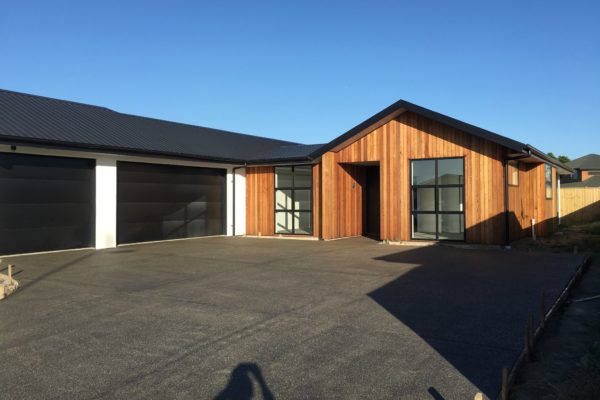 A coloured concrete driveway in Rolleston New Zealand completed by Concrete4U